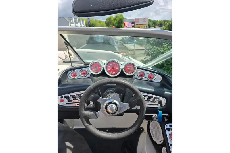 Slide: The Image of 2006 MasterCraft X-45 boat dashboard with steering wheel and gauges. - 3