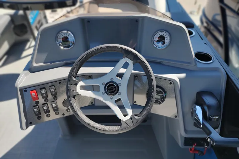 Slide: The Image of Steering console of 2026 Sylvan R-22 boat with gauges and controls. - 1