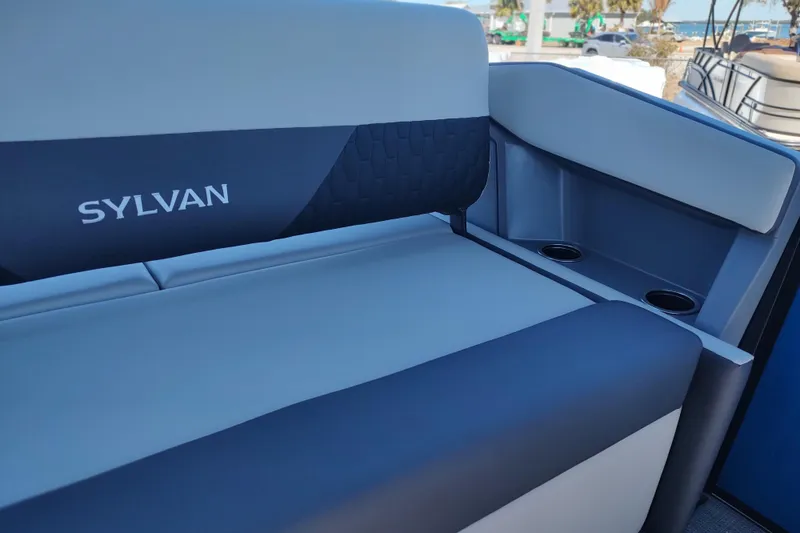 Slide: The Image of 2026 Sylvan R-22 boat interior with sleek seating and cup holders. - 13