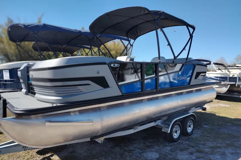 Slide: The Image of 2026 Sylvan R-22 pontoon boat with canopy on a trailer. - 3