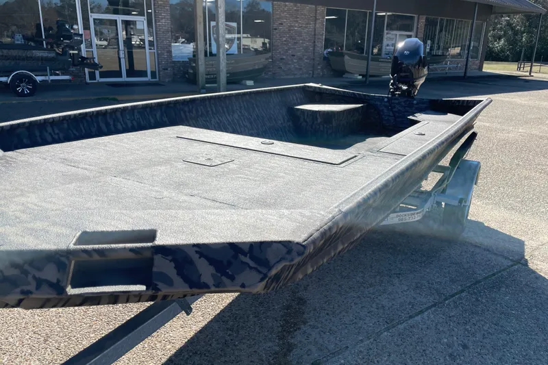 Slide: The Image of 2026 Weldcraft 1652 Predator boat on trailer, parked outside dealership. - 7