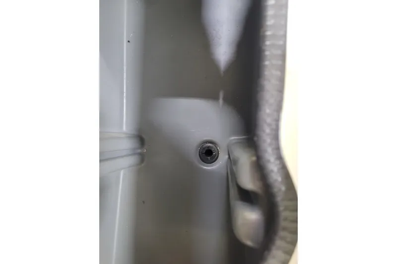 Slide: The Image of Close-up of a 2025 Ranger RB210 interior component with a visible screw hole. - 11