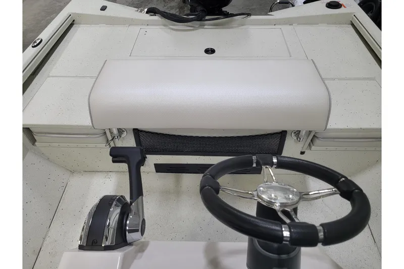 Slide: The Image of 2025 Ranger RB210 boat interior with steering wheel and control panel. - 15