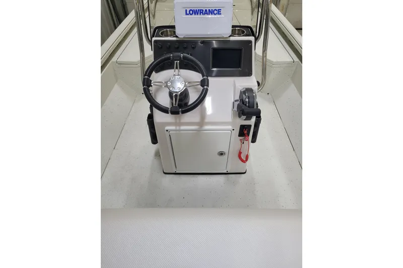 Slide: The Image of 2025 Ranger RB210 boat console with steering wheel and Lowrance electronics. - 17