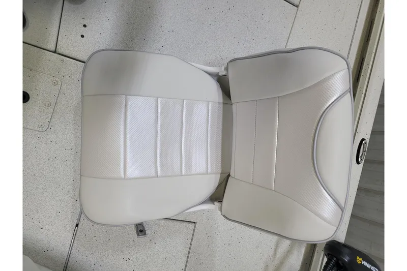 Slide: The Image of White seat in a 2025 Ranger RB210 boat, featuring sleek design and comfortable padding. - 22