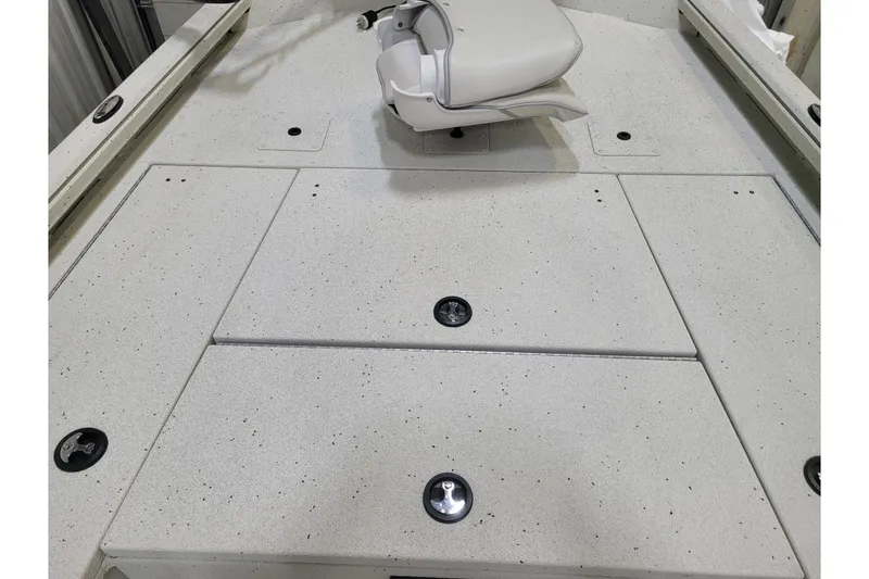 Slide: The Image of 2025 Ranger RB210 boat deck with storage compartments and swivel seat. - 24