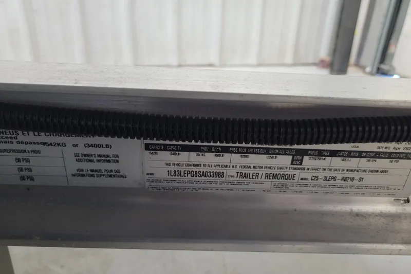 Slide: The Image of Label on Ranger RB210 trailer, 2025 model, showing capacity and specifications. - 28