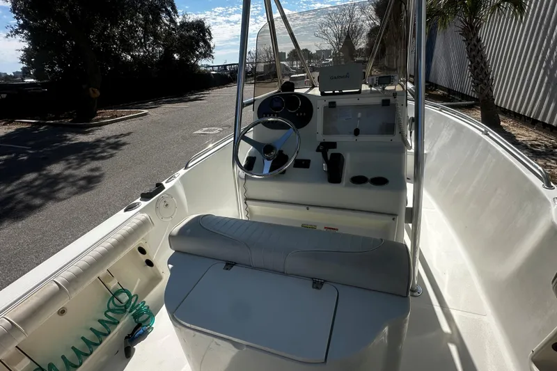 Slide: The Image of 2009 Sea Hawk 210 boat interior with steering console and seating. - 10