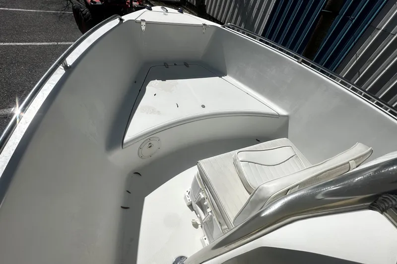 Slide: The Image of 2009 Sea Hawk 210 boat interior with seating and storage compartments. - 6