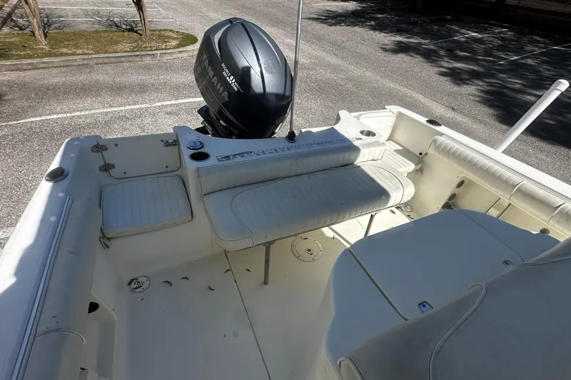 Slide: The Image of 2009 Sea Hawk 210 boat interior with Yamaha outboard motor in parking lot. - 8