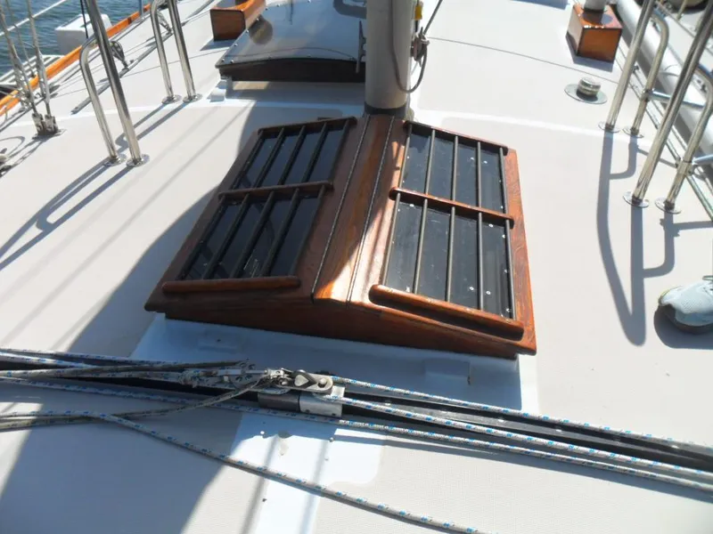 Slide: The Image of Deck of a 1976 Ericson 36C sailboat with wooden hatches. - 19