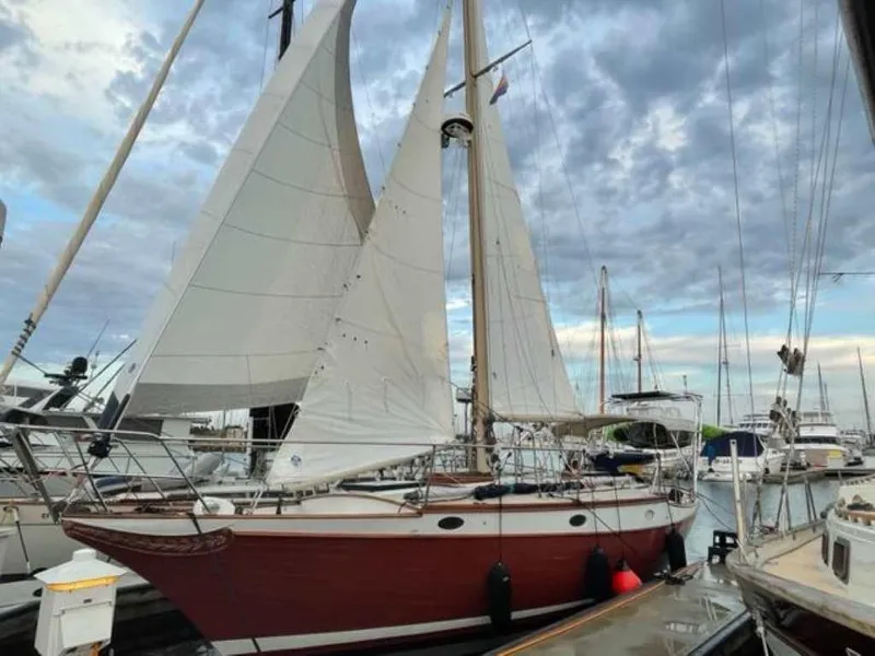 Slide: The Image of 1976 Ericson 36C sailboat docked in marina. - 2