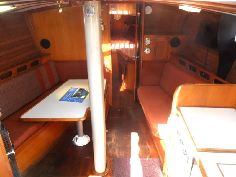 Slide: The Image of Interior of a 1976 Ericson 36C yacht with wooden furnishings. - 21