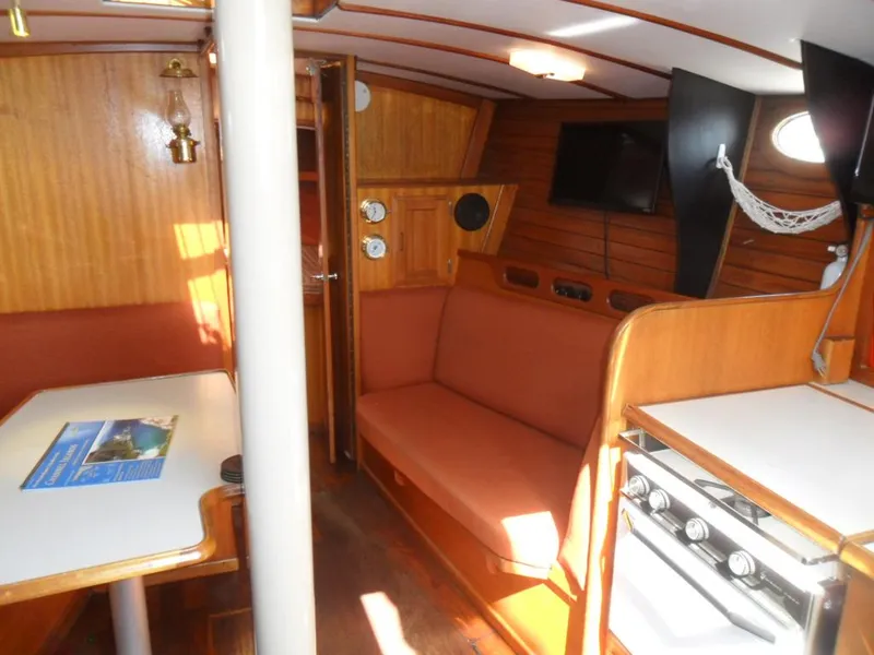 Slide: The Image of Interior of a 1976 Ericson 36C yacht with wooden furnishings. - 25