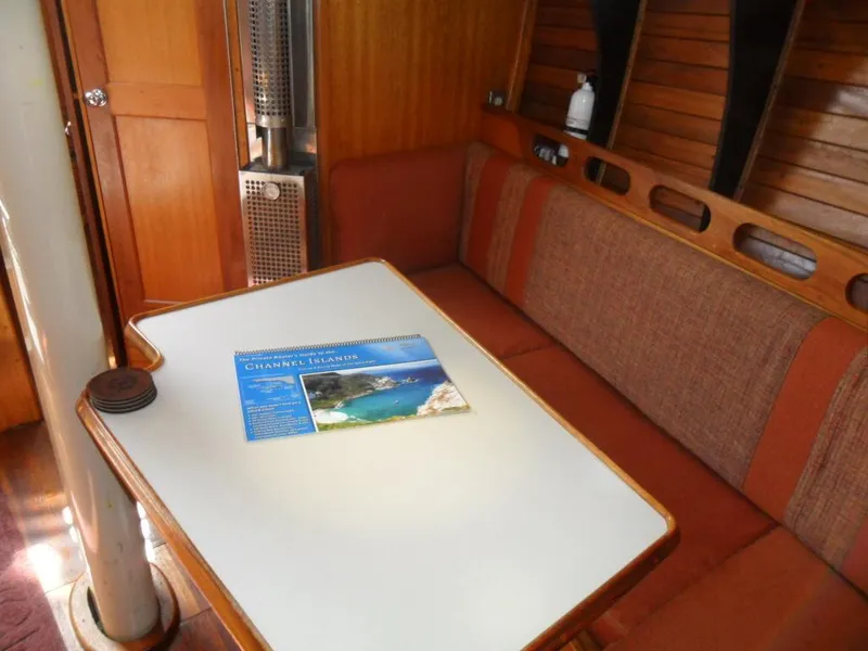 Slide: The Image of Interior of a 1976 Ericson 36C yacht with table and seating. - 26