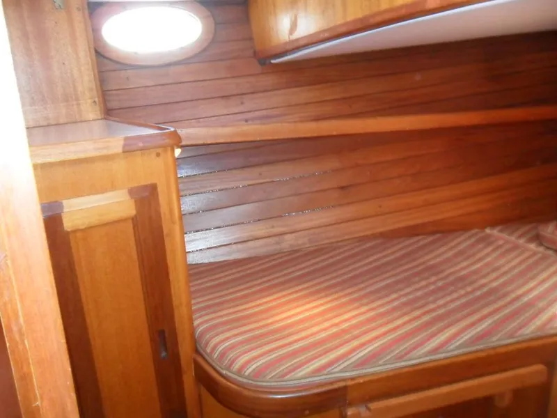 Slide: The Image of Interior of a 1976 Ericson 36C yacht with wooden finish. - 28