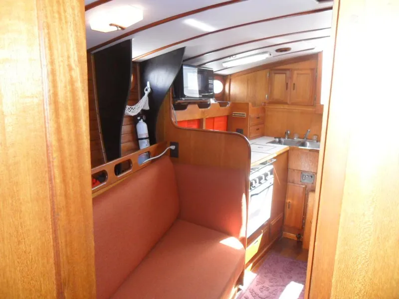 Slide: The Image of Interior of a 1976 Ericson 36C yacht with wooden furnishings. - 29