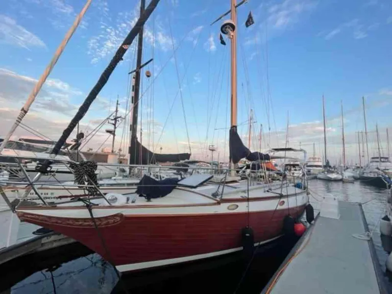 Slide: The Image of 1976 Ericson 36C sailboat docked at marina during sunset. - 3