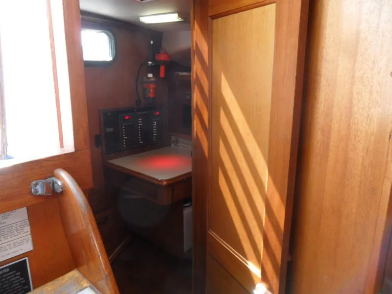 Slide: The Image of Interior of a 1976 Ericson 36C yacht with wooden furnishings. - 33