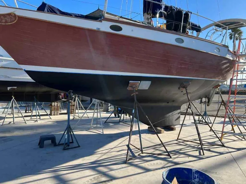 Slide: The Image of 1976 Ericson 36C sailboat on stands in a boatyard. - 8