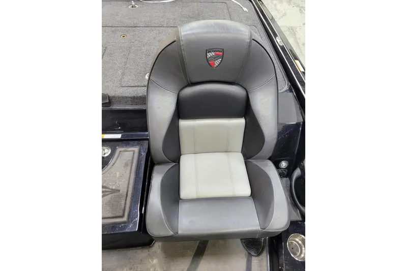 Slide: The Image of 2025 Triton 21XP boat seat, black and gray design, with logo on headrest. - 20
