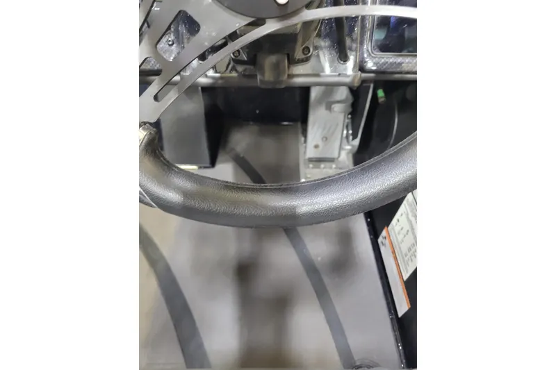 Slide: The Image of Steering wheel and dashboard of 2025 Triton 21XP boat interior. - 28