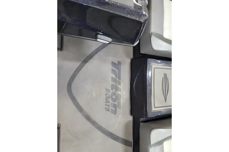 Slide: The Image of 2025 Triton 21XP boat interior with logo on floor mat. - 29