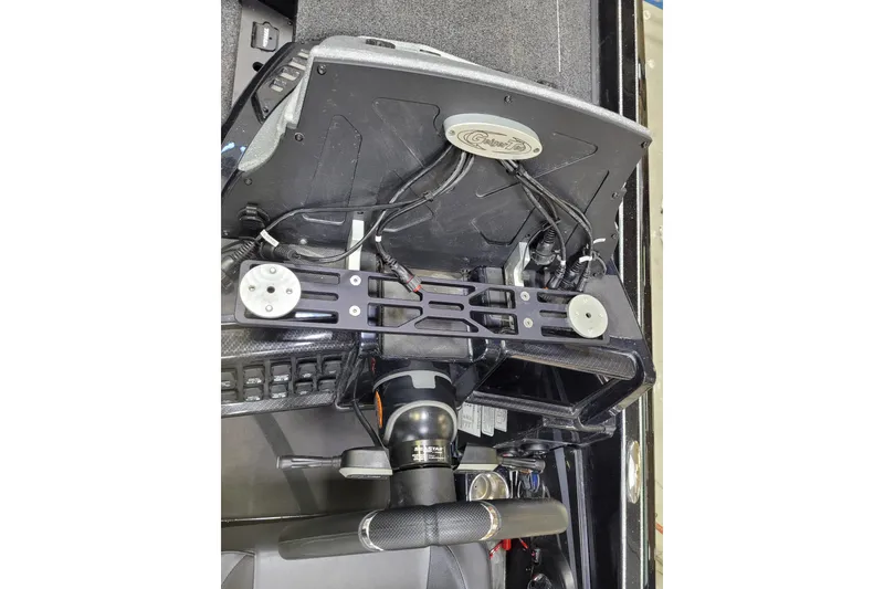 Slide: The Image of 2025 Triton 21XP boat dashboard with steering wheel and electronic controls. - 31