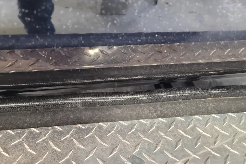 Slide: The Image of Close-up of Triton 21XP 2025 model with diamond plate detail. - 36