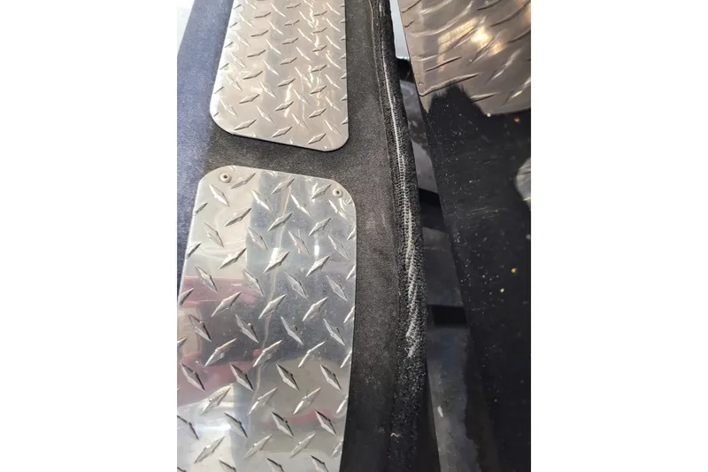 Slide: The Image of Close-up of Triton 21XP 2025 model with diamond plate metal details. - 37