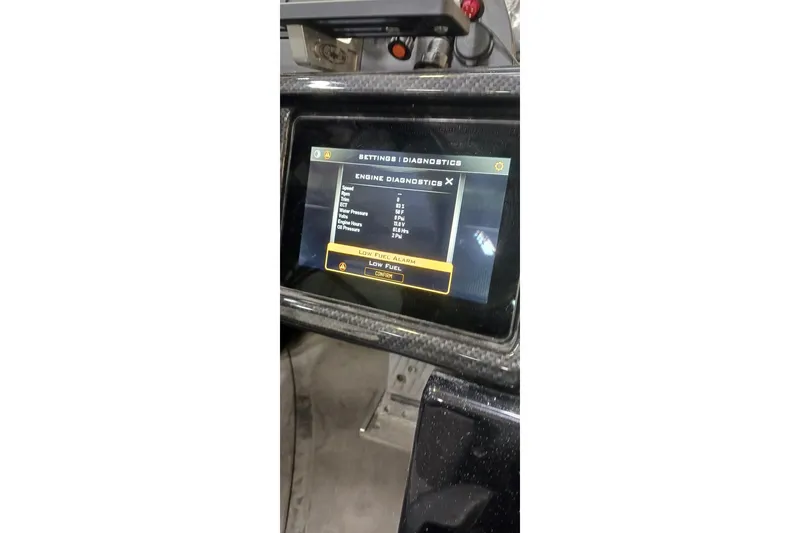 Slide: The Image of Dashboard of 2025 Triton 21XP displaying engine diagnostics on a digital screen. - 42