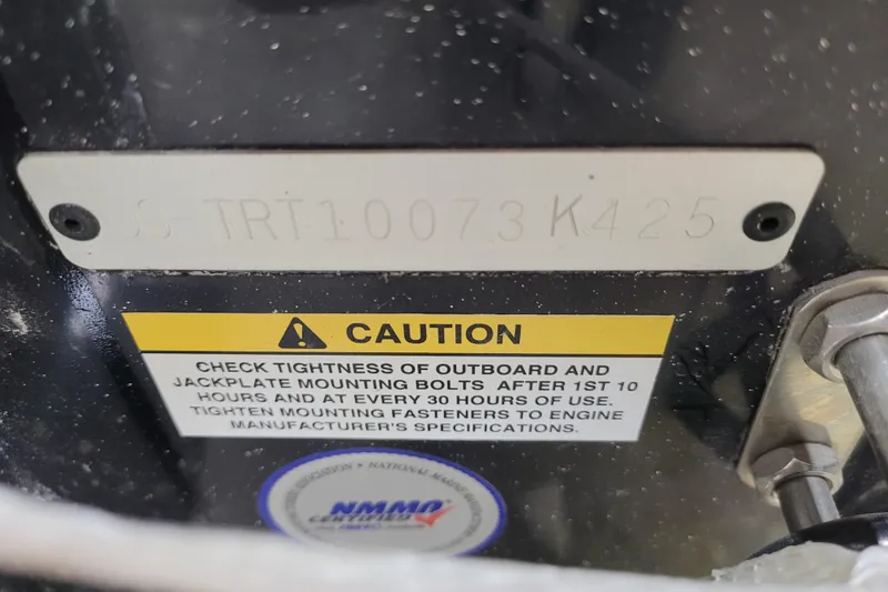 Slide: The Image of 2025 Triton 21XP caution label with serial number and bolt tightening instructions. - 43