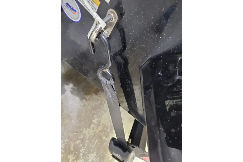 Slide: The Image of 2025 Triton 21XP boat with a secure metal hook and strap attachment. - 48