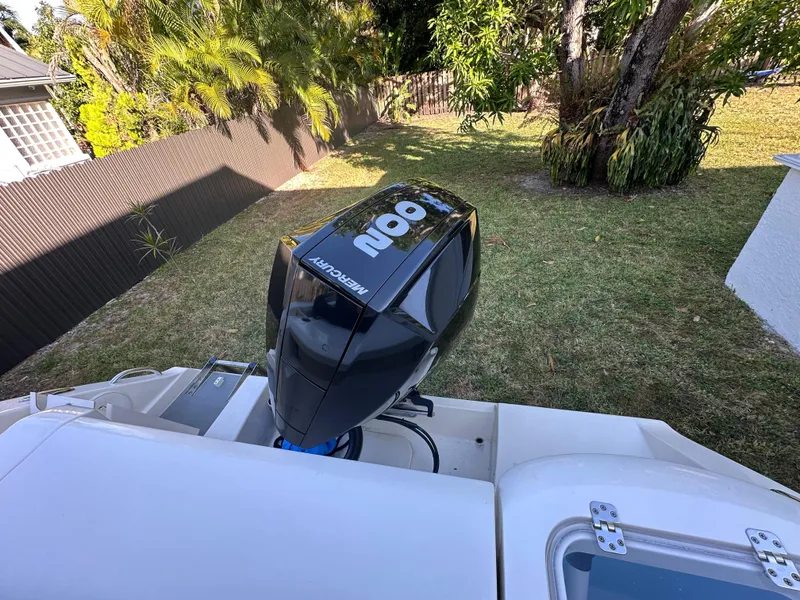 Slide: The Image of 2022 Cobia 220 Dual Console with Mercury outboard motor. - 15