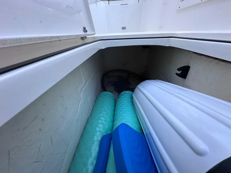 Slide: The Image of Storage compartment in Cobia 220 Dual Console boat, 2022 model. - 22
