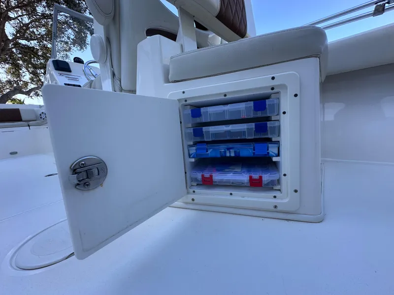 Slide: The Image of Storage compartment in 2022 Cobia 220 Dual Console boat. - 23