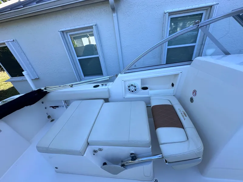 Slide: The Image of Interior of a 2022 Cobia 220 Dual Console boat with seating area. - 24