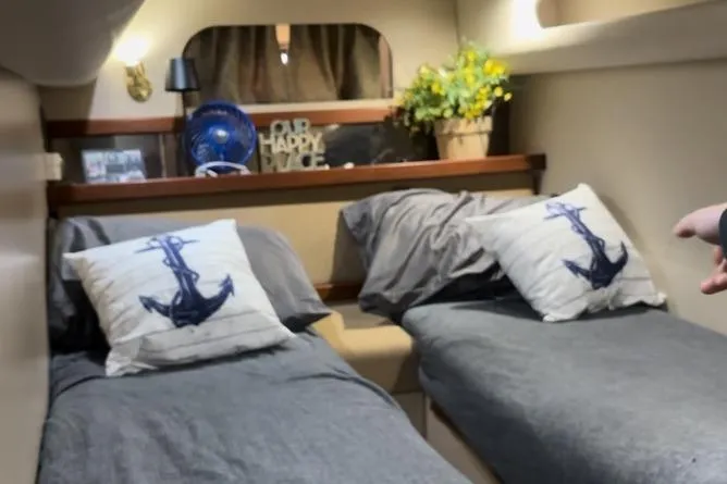 Slide: The Image of Interior of 2000 Cruisers 3870 yacht with twin beds and nautical decor. - 7