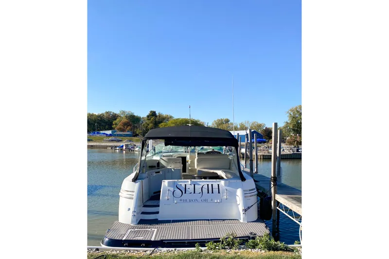 The Image of 2000 Cruisers 3870 yacht docked on a sunny day with clear skies. - 0
