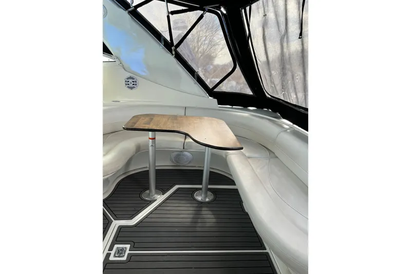 Slide: The Image of Interior of 2000 Cruisers 3870 yacht with sleek seating and wooden table. - 23