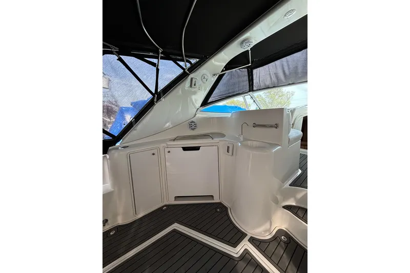 Slide: The Image of Interior view of 2000 Cruisers 3870 yacht with sleek white cabinetry and seating. - 25