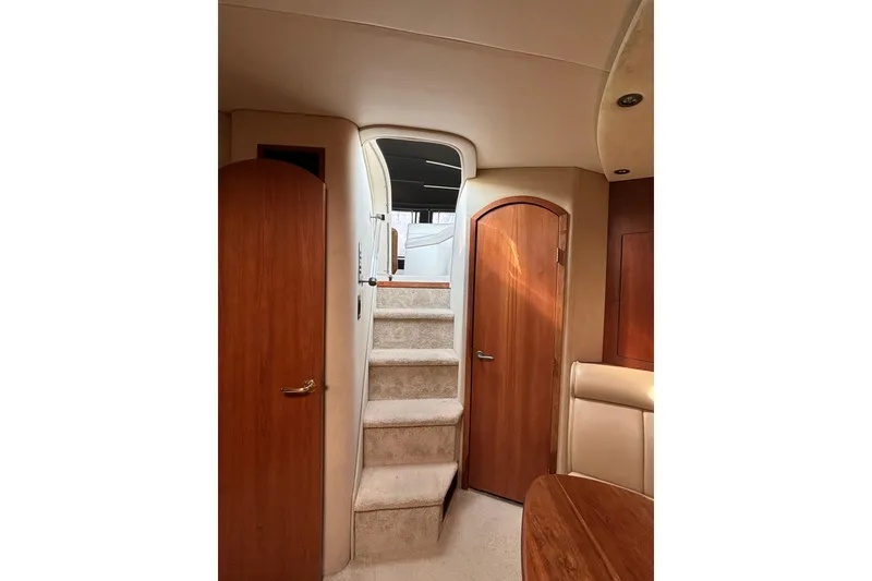 Slide: The Image of Interior of 2000 Cruisers 3870 yacht with wooden doors and carpeted stairs. - 31