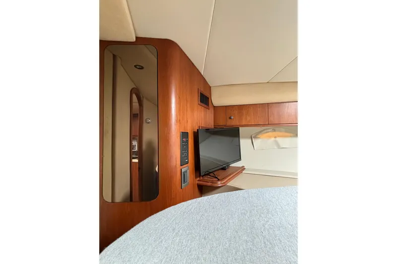 Slide: The Image of Interior of 2000 Cruisers 3870 yacht with TV and wooden cabinetry. - 45