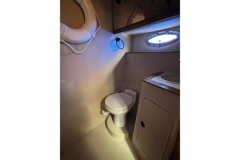 Slide: The Image of Bathroom interior of 2000 Cruisers 3870 yacht with porthole and life preserver. - 50