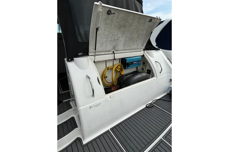Slide: The Image of 2000 Cruisers 3870 yacht storage compartment with equipment and cables visible. - 54