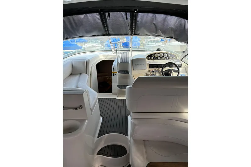 Slide: The Image of Interior view of 2000 Cruisers 3870 yacht cockpit with steering wheel and seating. - 16