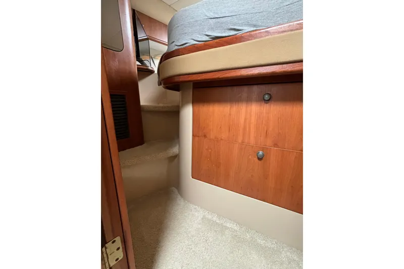 Slide: The Image of Interior of 2000 Cruisers 3870 yacht showing wooden cabinetry and carpeted steps. - 46