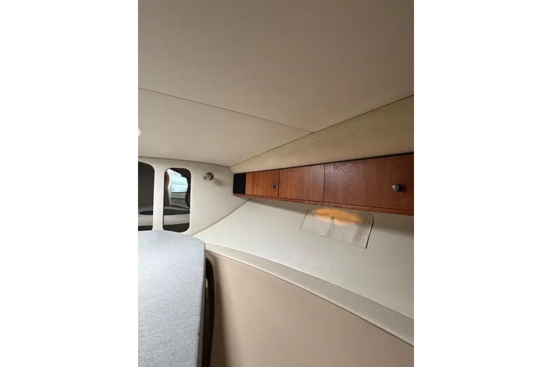 Slide: The Image of Interior of 2000 Cruisers 3870 yacht with wooden cabinets and upholstered seating. - 53