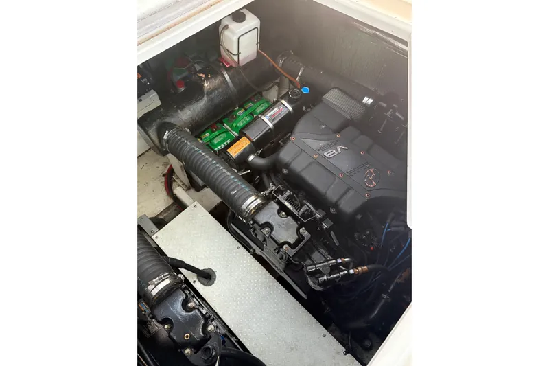 Slide: The Image of Engine compartment of a 2000 Cruisers 3870 boat, featuring a V8 engine. - 55