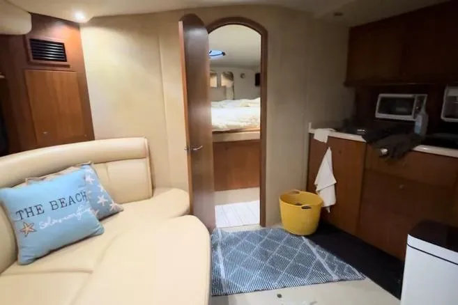 Slide: The Image of Interior of 2000 Cruisers 3870 yacht with cozy seating and kitchenette. - 6